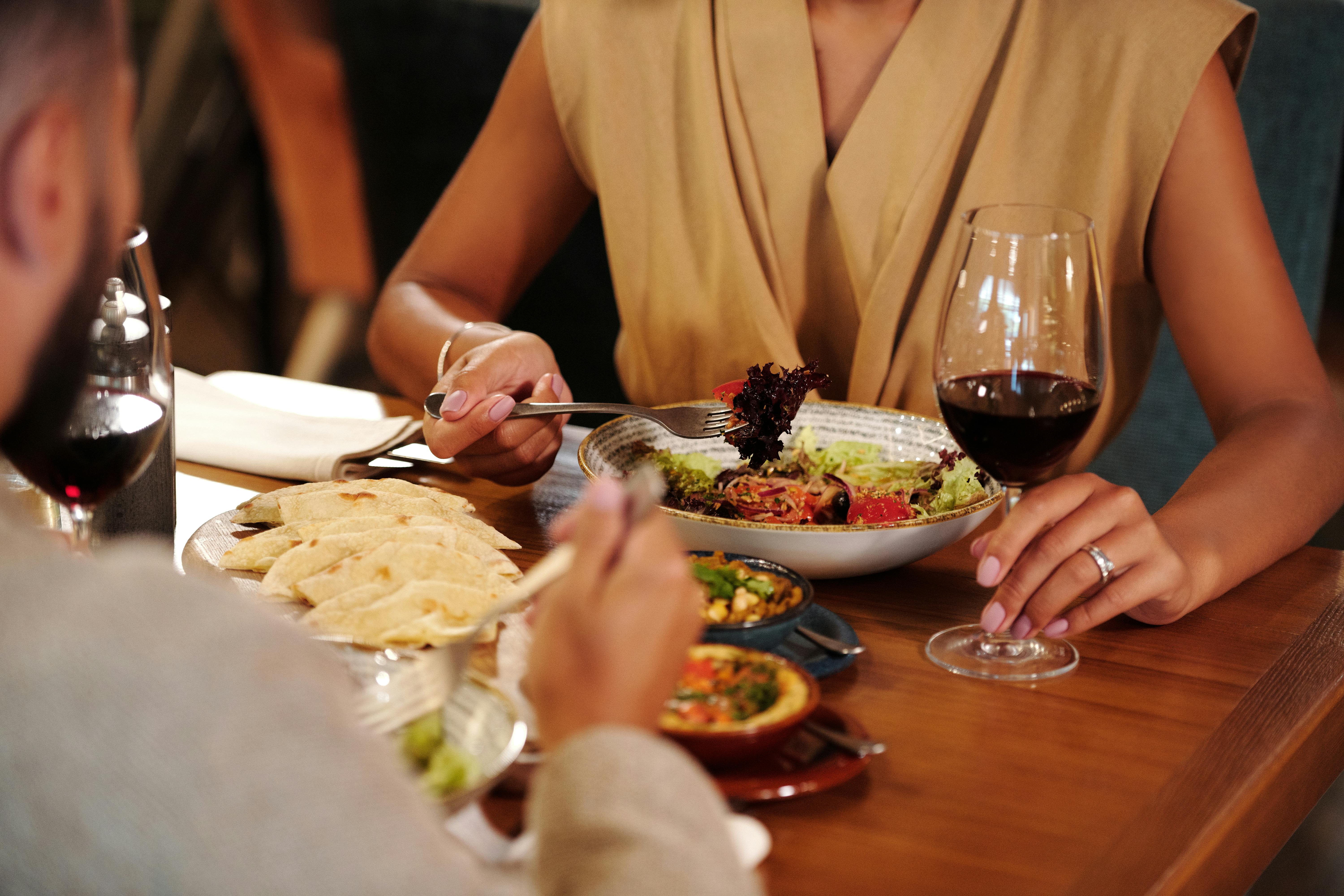 Couple sitting at a table eating in a restaurant