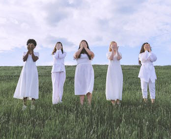 Woman with their hands over their eyes